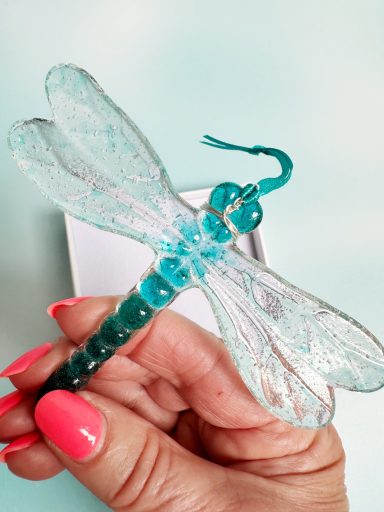 Fused glass dragonfly in turquoise and clear, with ribbon for hanging