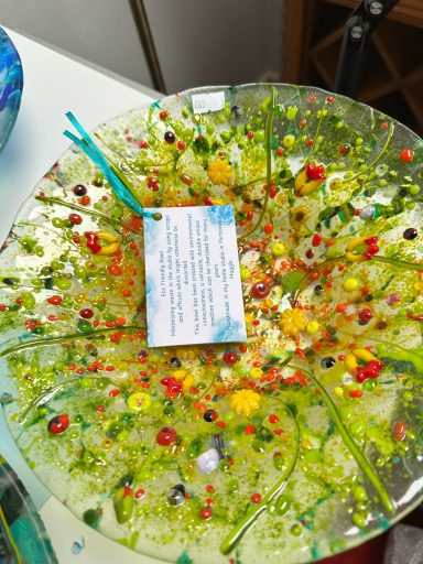 Fused glass bowl using recycled colourful glass pieces.