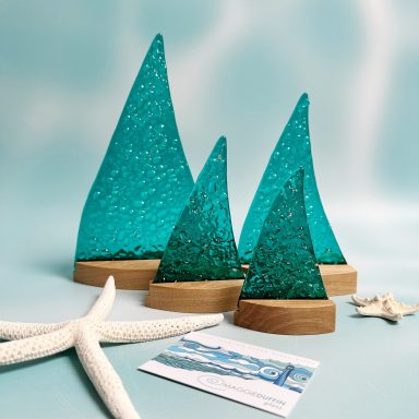 Peacock blue sailboats.
